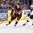 COLOGNE, GERMANY - MAY 13: Latvia's Oskars Cibulskis #27 skates with the puck while USA's Nick Bjugstad #14 chases him down during preliminary round action at the 2017 IIHF Ice Hockey World Championship. (Photo by Andre Ringuette/HHOF-IIHF Images)

